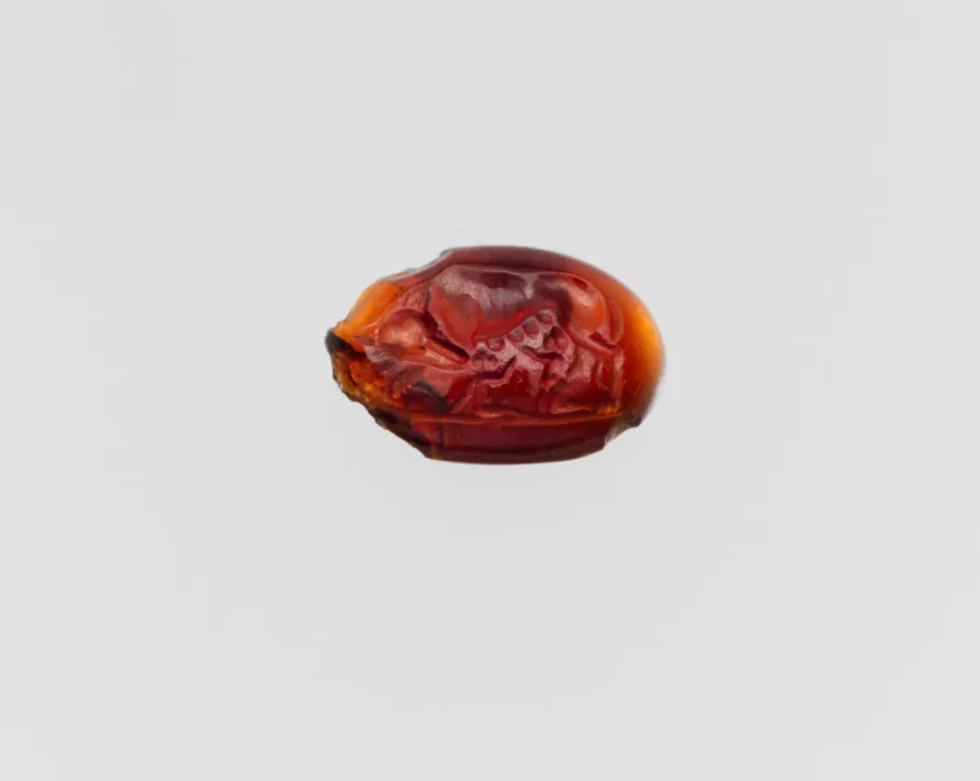 Intaglio romano de granate con la loba amamantando a Romulo y Remo, siglo II a. C. al III d. C.